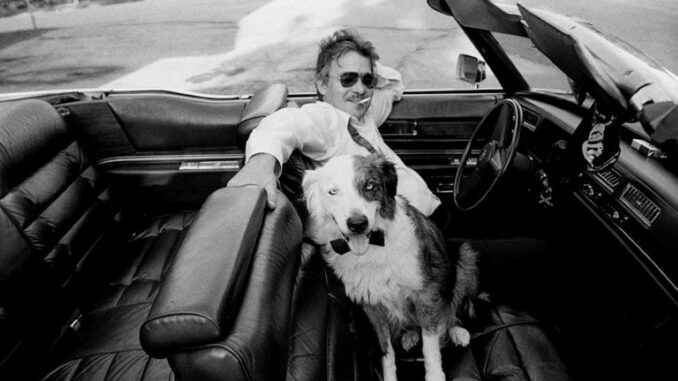 John Prine with dog and Cadillac