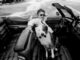 John Prine with dog and Cadillac